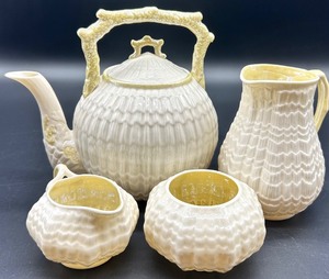 lot 154 image: Belleek Limpet Pattern Tea Set with Teapot, Creamer, Sugar Bowls and Pitcher