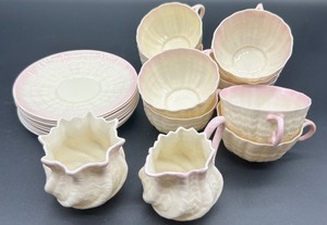 lot 158 image: Belleek Neptune pink Shell Pink Creamer, Sugar, and 9 Cups with 9 Saucers