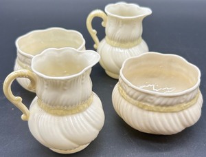 lot 173 image: Belleek Ribbon Creamers and Sugar Bowls Set of 4