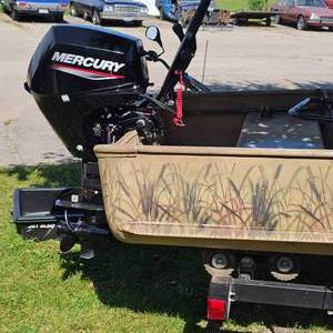 lot 5 image: Alumacraft 14 ft Duck Boat w2023 Like New Mercury 4 Stroke 15hp, and 2023 Karavan Trailer