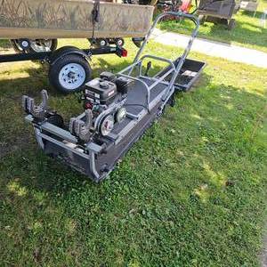 lot 6 image: Like New, Snow Dog Tracked Ice Fishing Machine, used twice, Like New