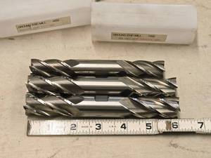 lot 878 image: Lot of (3) 4 Flute Double Sided HSS End Mill - 78 (x2), 34 (x1)