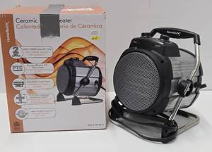 lot 118 image: Working New or Like-New HomeBasix Portable heater