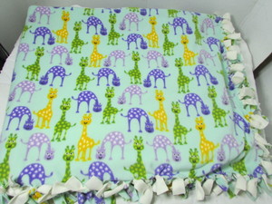 lot 56 image: Giraffe Throw Blanket
