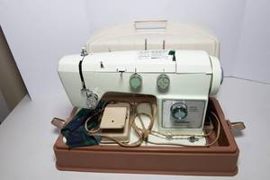 lot 50 image: Signature Zig Zag Sewing Machine  Model UHT J2760