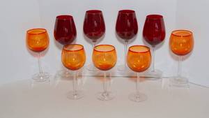 lot 86 image: Set of 9 Orange and Red Wine Glasses
