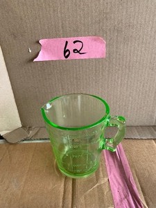 lot 62 image: Uranium glass 4 cup measure
