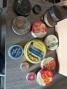lot 143 image: Tin lids and containers