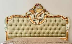 lot 40 image: French Style Asnaghi Upholstered King Headboard with Carved Floral Detail