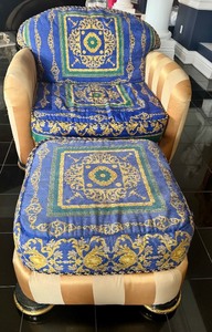 lot 43 image: J. Coro Upholstered Armchair and Ottoman with Versace Fabric