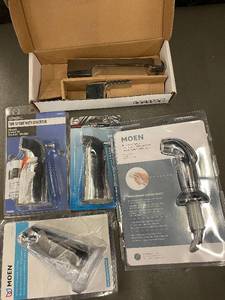 lot 26 image: Moen Chrome Kitchen and Tub Faucet Parts Assortment