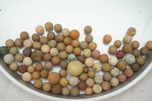 lot 19 image: Antique Clay Marbles (94ct)