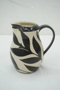 lot 186 image: Melanie McEvoy Carved Pottery Pitcher 7 tall