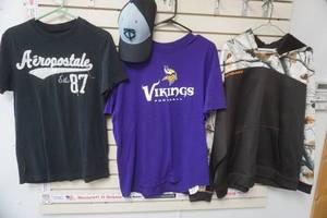 lot 191 image: XL MN Vikings T-Shirt, XL Legendary Camo Sweatshirt, M Aeropostale Shirt, Black & Blue MN Twins Hat