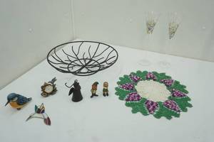 lot 198 image: Decor Lot Vintage Leprechaun Figurines, Hummingbirds, Iron Angel, Grape Cluster Doily