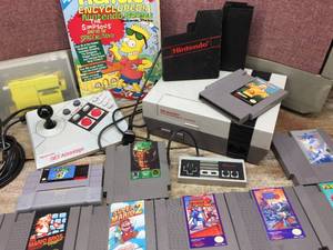 lot 180 image: Vintage Nintendo NES - Console - Controller - Game Cartridges