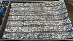lot 16 image: Gray and White Striped Polyester Bathmat 24 x 36