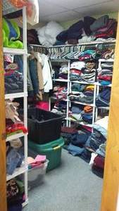 lot 208 image: Room FULL of Clothes, Shoes, Hats, Coats, Blankets, Jeans, and More. See Pics All Sizes, New, Like New and Gently Used. Shelving and Hangers are NOT INCLUDED. Small area in Room is used for personal storage and not included.
