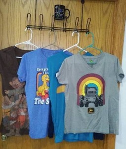 lot 223 image: John Deere, Disney, Angry Birds Sesame Street T-Shirts and Mug.