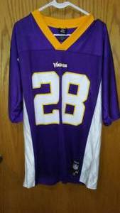 lot 272 image: NFL Football Vikings 28 Peterson Jersey.