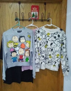 lot 275 image: Peanuts Book, Sweatshirts (2) and T-Shirts (2).