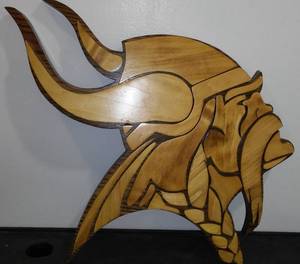 lot 209 image: Wood Viking Wall Dcor. Approx. 15 x 17 in.