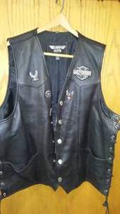 lot 216 image: Harley Davidson Leather Vest (3XT) Snap Front, Lace Sides, Eagle on Back. Excellent Condition inside and out.