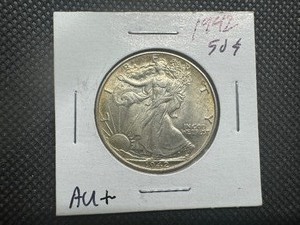 lot 18 image: 1942 High Grade Walking Liberty Half. AU or Better