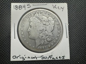 lot 50 image: 1884 S Key Date Morgan Dollar. Original Surfaces. Sigma Verified .90 Pre 1900