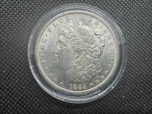 lot 56 image: 1885 O Gem Uncirculated Morgan Dollar. MS Sigma Verified .90 Fine Pre 1900