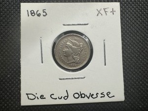 lot 88 image: 1865 XF 3 Cent Nickel Die Cud Obverse on Rim to left of Liberty