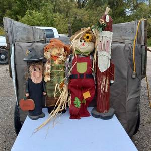 lot 18 image: Decorative Fall and Christmas Figures including Scarecrow, Witch, and Santa