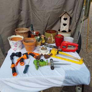 lot 39 image: Garden Tools and Pots Collection including Electric Homelite Hedge Trimmer, Watering Accessories, and Decorative Planters