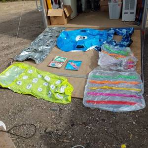 lot 74 image: Inflatable Water Toys and Accessories including Havasu Towable Tube, Neon Frosted Mat, and Inflatable Ride Em Surfer