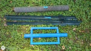 lot 14 image: T-Post Driver, Steel Fence Posts, and Roll of Wire Fencing