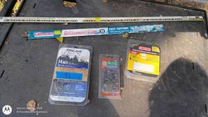 lot 21 image: Group of Hand Saw Blades and 14 Inch Chainsaw Chains