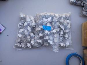 lot 27 image: 3 bags of 14 inch NPT Stainless Steel Union fittings. Approx 75 pcs.