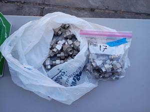 lot 29 image: 2 bags of 14 inch NPT Stainless Steel Union fittings.