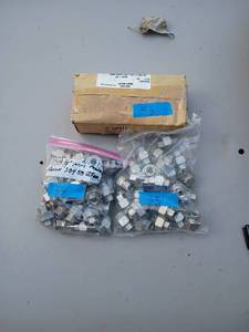 lot 33 image: 1 box and 2 bags of 14 inch NPT Stainless Steel Union fittings. Approx 75 pcs. 150 PSI