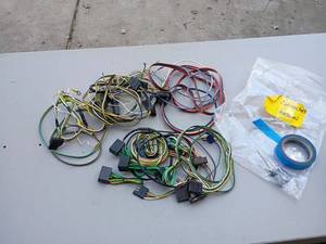 lot 52 image: Assorted Automotive Wiring Harnesses with Electrical Tape