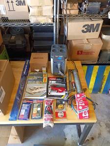lot 55 image: Vintage Automotive Repair Manuals and Car Accessories Lot