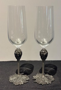 lot 104R image: L - Pair of Baker Art Foundry Champagne Flutes with Decorative Pewter Stems