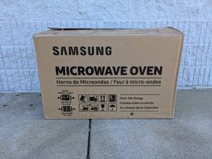 lot 95 image: NEW SAMSUNG OVER THE RANGE MICROWAVE OVEN