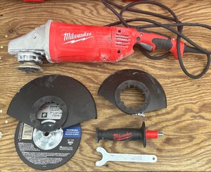 lot 24 image: Milwaukee 15 Amp 79 in. Large Angle Grinder with Trigger Lock-On Switch USED 6088-30 MSRP $249