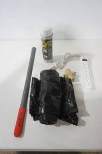 lot 197 image: White Flex Seal, Black Garbage Bags, Power Strip, Adaptor, Shoe Horn
