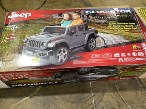 lot 451 image: 12V Jeep Gladiator Rubicon Battery Powered Ride-on, 2-Seater, Gray, Child Ages 3-8, Max Speed 5 mph. DOES NOT WORK.