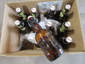 lot 276 image: Amber Grolsch Beer Bottles