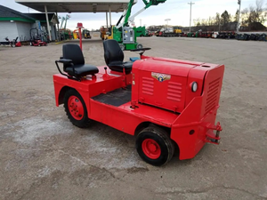 lot 25 image: Fire Engine Red Airport Tow Tractor