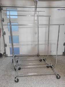 lot 27 image: 3 Collapsible Chrome Steel Rolling Clothing Racks. Different sizes.