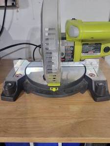 lot 31 image: RYOBI 9-amp 7-14 in. Miter Saw. TS1143L